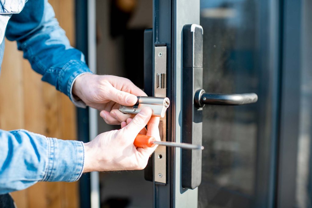 man-changing-core-of-a-door-lock-GK3HTJ5.jpg